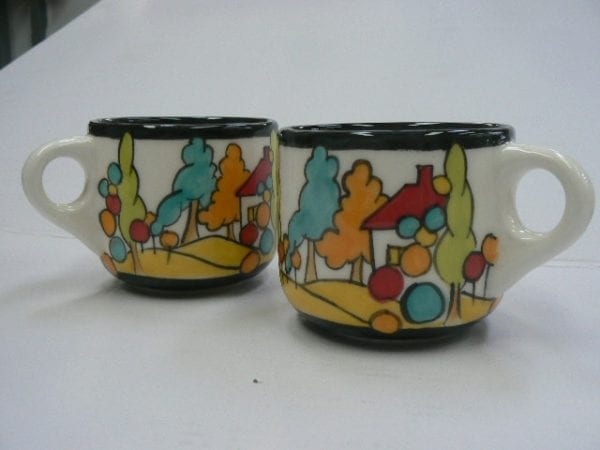 Mugs with landscape in orange, red, greens and blues